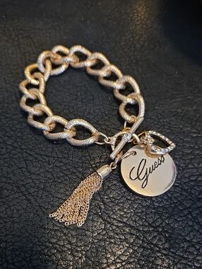 Vintage Guess Gold-Tone Textured Chain Bracelet with Signature Disc and Tassel